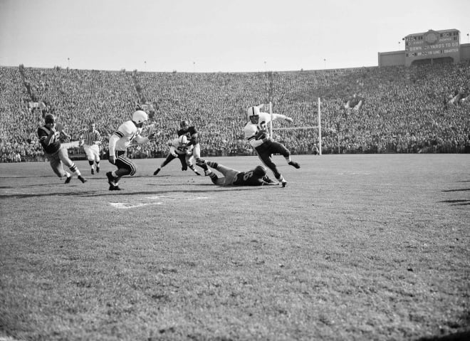 Wisconsin Halfback Bill Hutchinson runs toward the sideline during the 1953 Rose Bowl. 