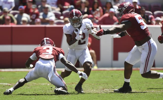 Crimson team defensive back Terrion Arnold (3) and Crimson team defensive lineman Tim Smith (50) combine to tackle White team running back Jase McClellan (2) during the A-Day game at Bryant-Denny Stadium. Photo | Gary Cosby-USA TODAY Sports