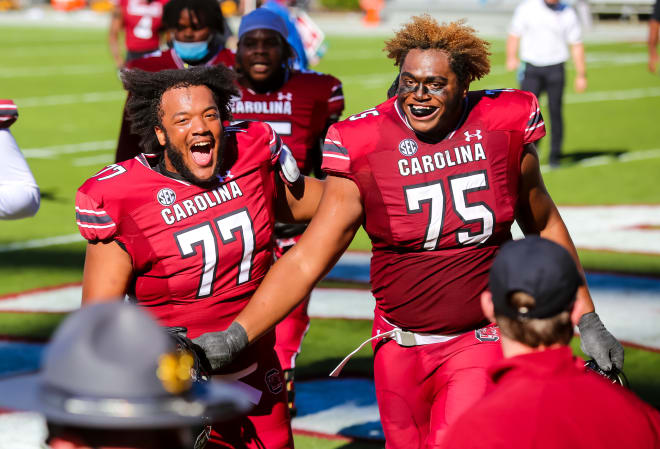 Oct 17, 2020; Columbia, South Carolina; South Carolina Gamecocks offensive lineman lineman Jazston Turnetine (75) and teammates celebrate following their win over the Auburn Tigers at Williams-Brice Stadium. 