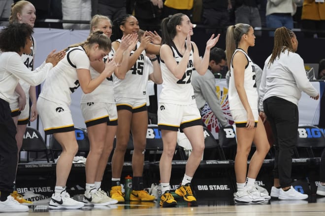 Iowa guard Caitlin Clark, center, celebrates with teammates as time expires in the team's win over Michigan following an NCAA college basketball game in the semifinals of the Big Ten women's tournament Saturday, March 9, 2024, in Minneapolis.