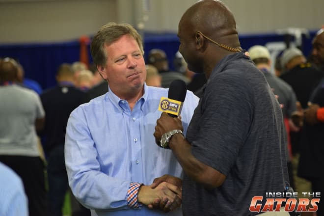 Florida head coach Jim McElwain shakes hands with the SEC Network's Booger McFarland