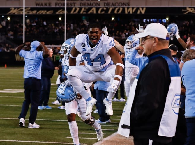 Freshman LB Deuce Caldwell and the Tar Heels celebrate after beating Wake Forest on Saturday night.