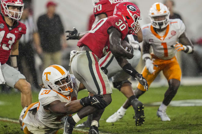 Tennessee defensive lineman Bryson Eason tries bringing down Georgia running back Daijun Edwards. 