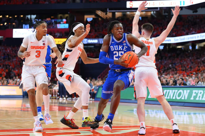 Duke's Mark Mitchell slices through Syracuse defenders during Saturday's game. 