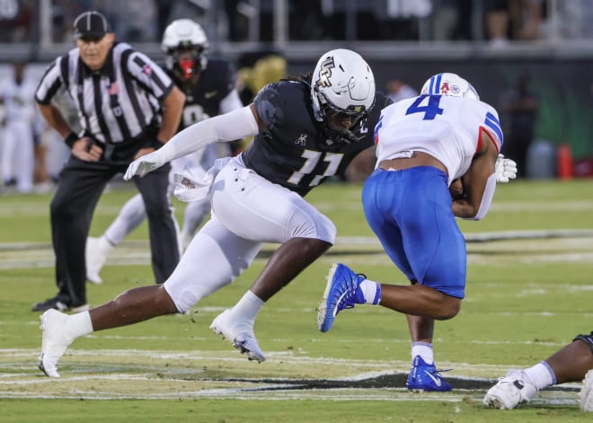 UCF Knights linebacker Jeremiah Jean-Baptiste (11) moves in for the tackle against Southern Methodist Mustangs running back Tre Siggers (4) during the second quarter at FBC Mortgage Stadium. Photo | Mike Watters-USA TODAY Sports
