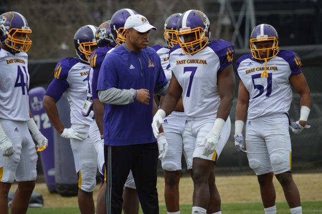 ECU linebacker coach Ryan Anderson is working to get the most out of his defensive group.      