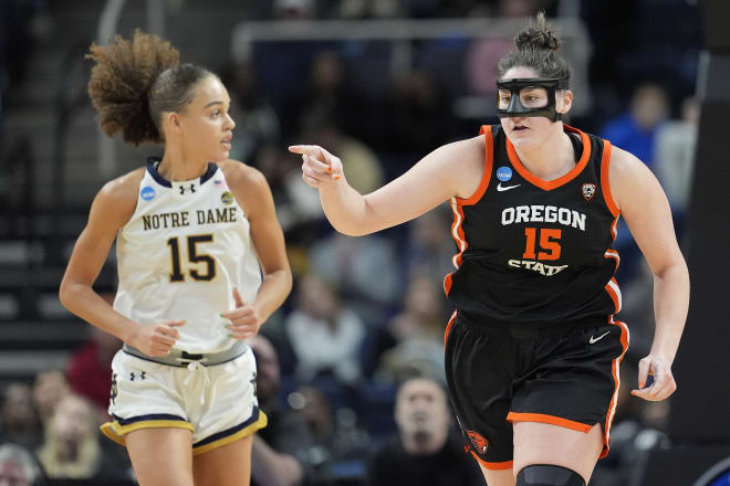 Notre Dame post Nat Marshall (left) and Oregon State counterpart Raegan Beers run down court during Friday's Sweet 16 matchup.
