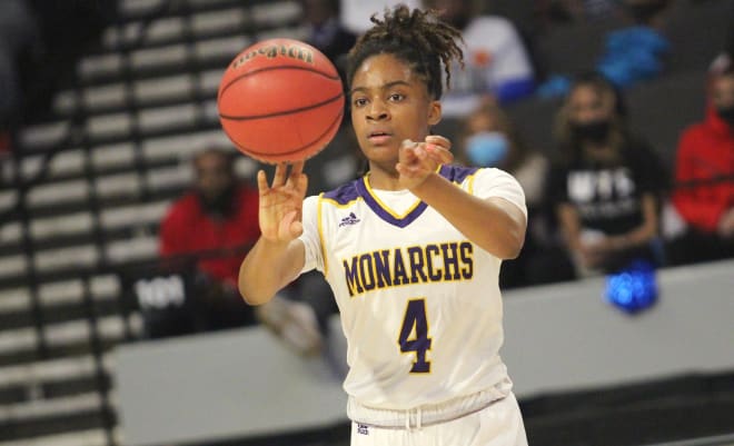 Amari Smith finished with 17 points on 8-of-13 shooting to go with eight rebounds as Menchville defeated previously unbeaten Woodgrove for the VHSL Class 5 Girls Basketball State Championship on March 11, 2022