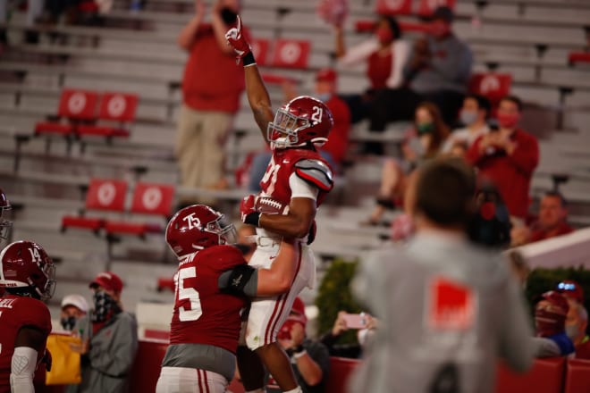 Alabama freshman running back Jase McClellan celebrates with offensive lineman Tommy Brown after scoring his first career touchdown. Photo | Getty Images