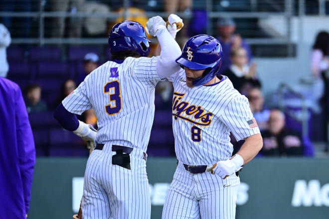 LSU second baseman Gavin Dugas (8) is congratulated by teammate Dylan Crews (3) after Dugas' first-inning leadoff solo homer got the No. 1 ranked Tigers rolling to a 5-3 Saturday afternoon win over Western Michigan in Alex Box Stadium. 