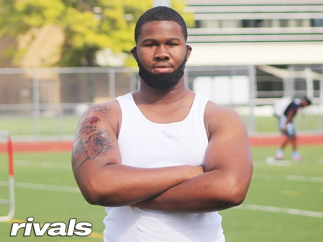 Rivals100 defensive lineman Rayshaun Benny holds a Michigan Wolverines football recruiting offer from Jim Harbaugh.