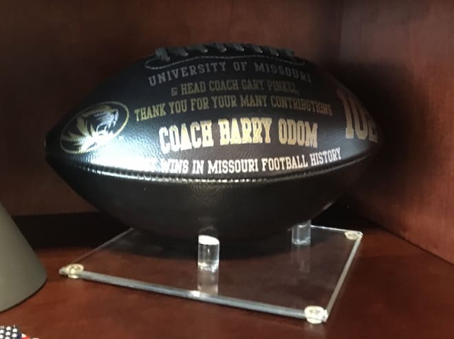 A commemorative football from Pinkel's 102nd win is one of many nods to Odom's long history at Mizzou