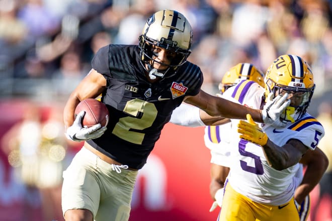 Jan 2, 2023; Orlando, FL, USA; Purdue Boilermakers wide receiver Abdur-Rahmaan Yaseen (2) stiff arms LSU Tigers safety Jay Ward (5) during the second half at Camping World Stadium. Mandatory Credit: Matt Pendleton-USA TODAY Sports