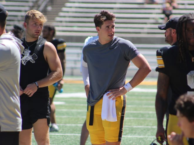 Iowa starting quarterback Cade McNamara went down with an apparent leg injury during Iowa's open practice on Saturday. 