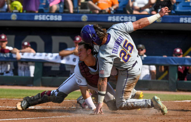 LSU base runner Hayden Travinski is out at home as Texas A&M catcher Max Kaufer holds onto the throw on a poorly executed safety squeeze play that killed a Tigers' fifth-inning rally in an eventual 5-4 SEC tournament losers bracket loss Friday afternoon in Hoover, Ala.,