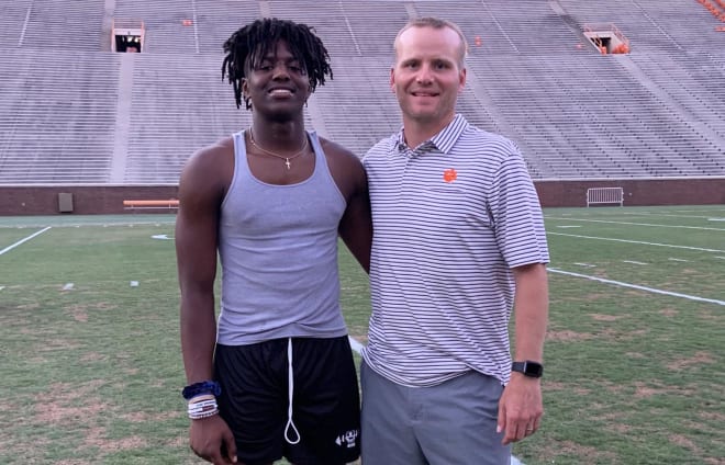 Henry is shown here in Death Valley with Clemson offensive coordinator Brandon Streeter last summer.
