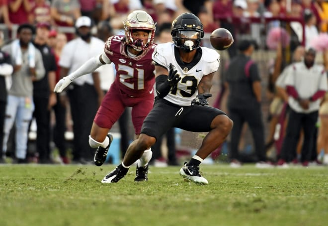 Wake Forest's Ke'Shawn Williams makes a catch in front of FSU's Greedy Vance during last season's matchup. 