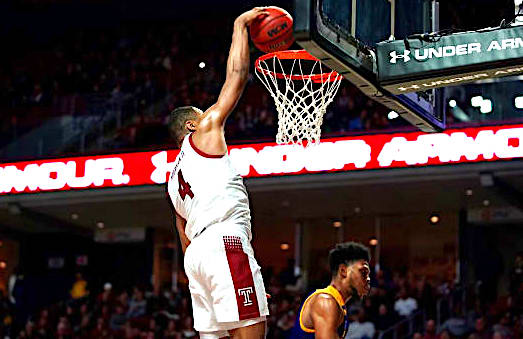 J.P. Moorman dunks on ECU's Jayden Gardner in Temple's 76-64 win over the Pirates Saturday night in Philadelphia.