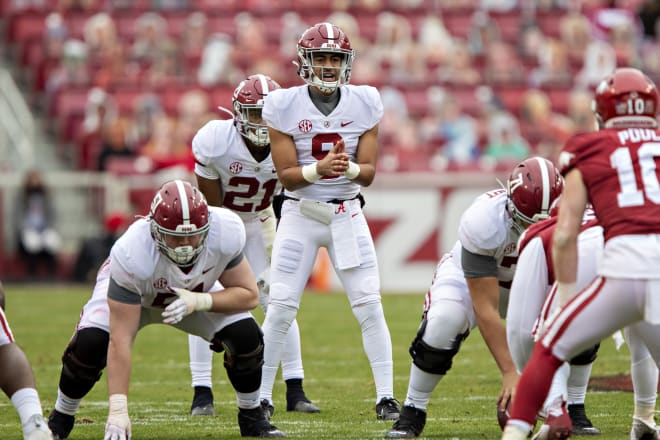 Bryce Young prepares to take a snap before Alabama's game against Arkansas last season. Photo | Getty Images 
