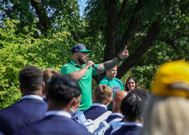 Former Notre Dame All-America linebacker Manti Te'o addresses Irish fans during ND's Victory march player walk before the ND-Cal game on Saturday. 