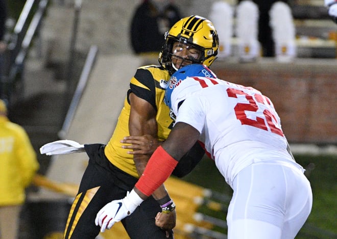 Ole Miss defensive lineman Tariqious Tisdale hits Missouri's Kelly Bryant Saturday night. The hit led to an ejection and a suspension, one which will force Tisdale to miss the first half of Saturday's game against Texas A&M. 