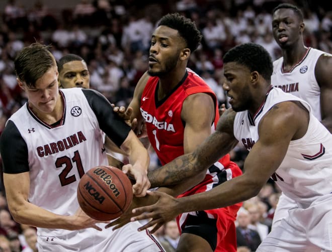 Gamecocks and Bulldogs battle for possession of the ball in Saturday's game.