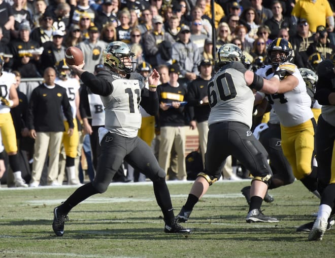 Purdue quarterback David Blough will continue to rely on the help of left tackle Eric Swingler (60) for a clean pocket this season.