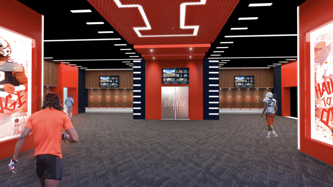 Wisconsin Football Locker Room - Guy holding football ...