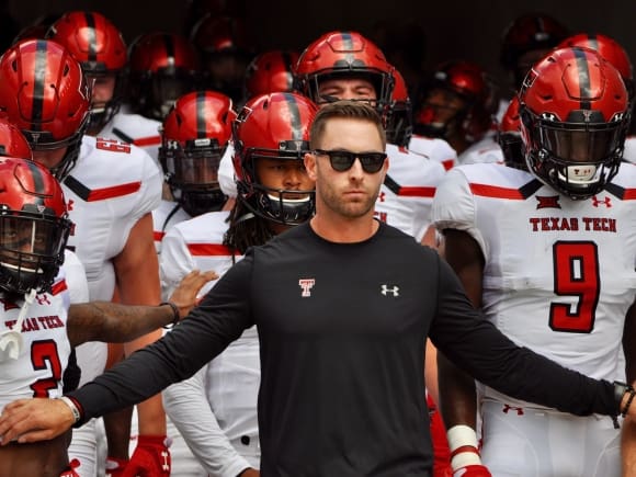 Texas Tech coach Kliff Kingsbury leads the Red Raiders out onto the field against Houston on Saturday.