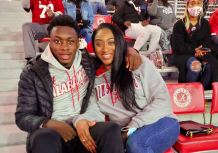 Xavier Worthy with his mom in Tuscaloosa on Saturday night. 