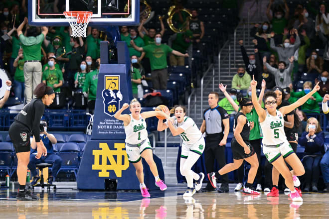 Notre Dame's Dara Mabrey (1), Sonia Citron (11) and Olivia Miles (5) react after Notre Dame defeated NC State, 69-66, Tuesday night at Purcell Pavilion in South Bend, Ind.