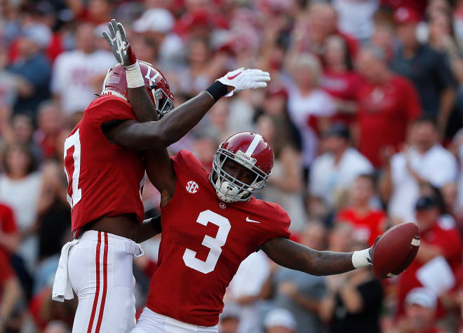 Alabama receivers Cam Sims (left) and Calvin Ridley celebrate during the Crimson Tide's 41-23 victory over Colorado State. Photo | Getty Images