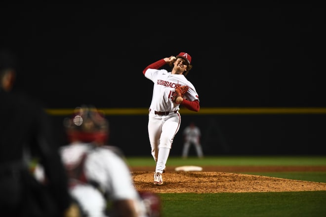 Razorback infielder Ben McLaughlin pitches during Tuesday's win over Omaha.