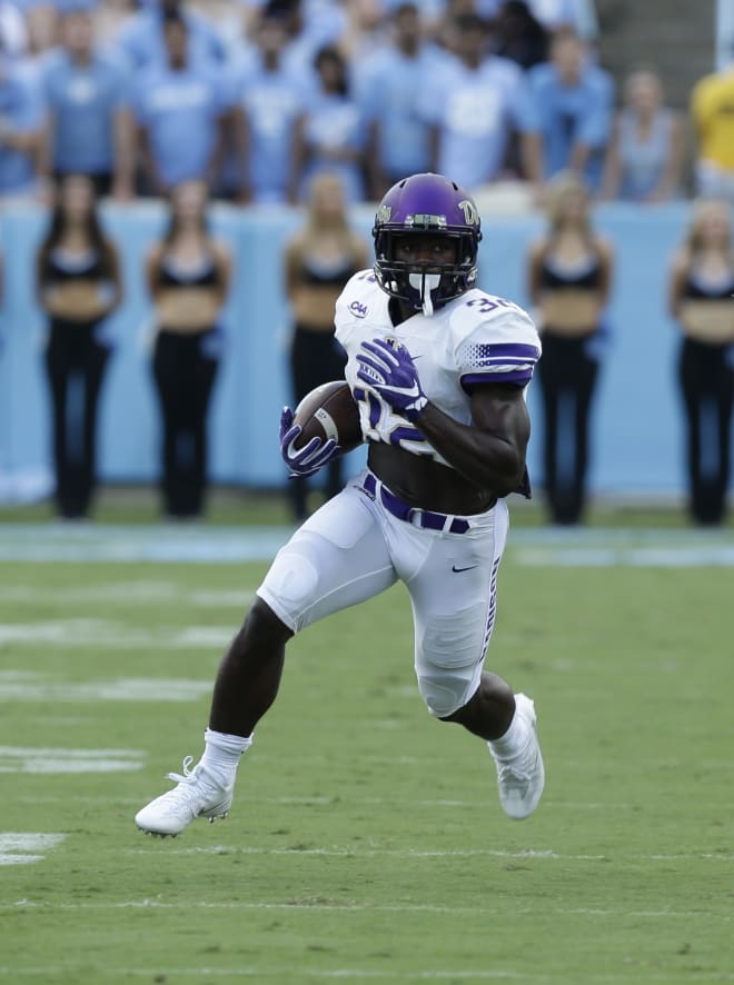 Former James Madison running back Khalid Abdullah carries the ball during the Dukes' 2016 contest at North Carolina in Chapel Hill, N.C.