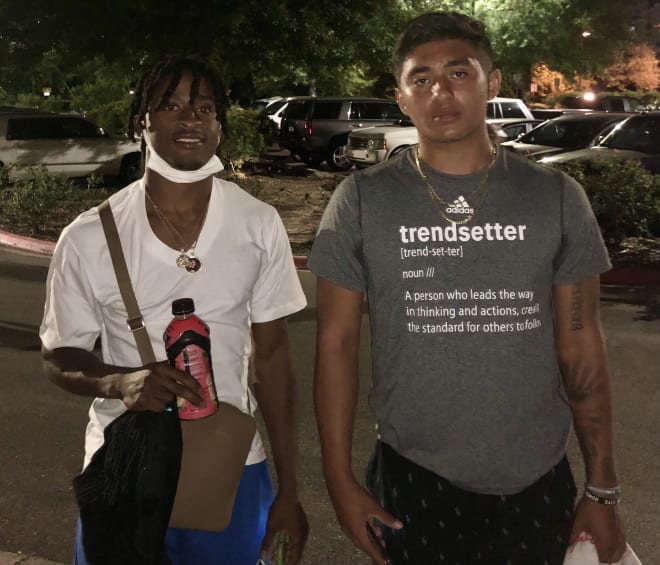 Five-star WR Kevin Coleman of St. Louis (left) arrives around midnight Monday with FSU quarterback commit A.J. Duffy.