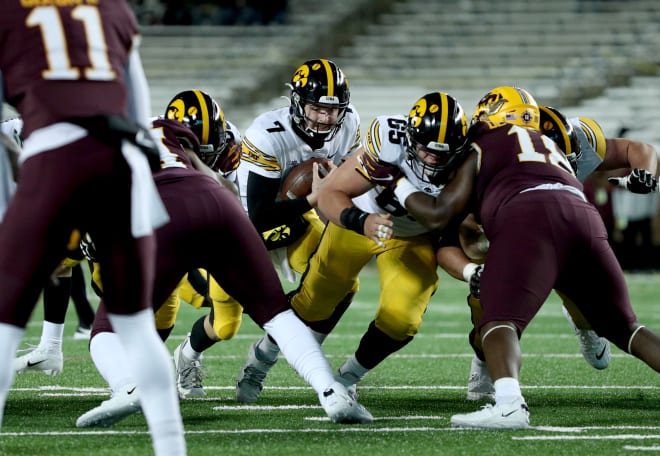 Tyler Linderbaum leads the way for the Iowa offensive line. 