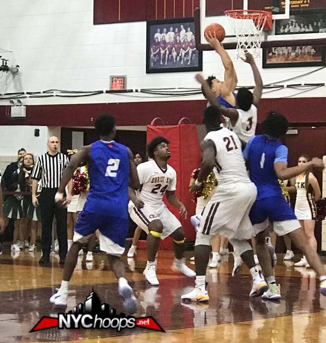 Cole Anthony tries to score against Christ the King's front court defense