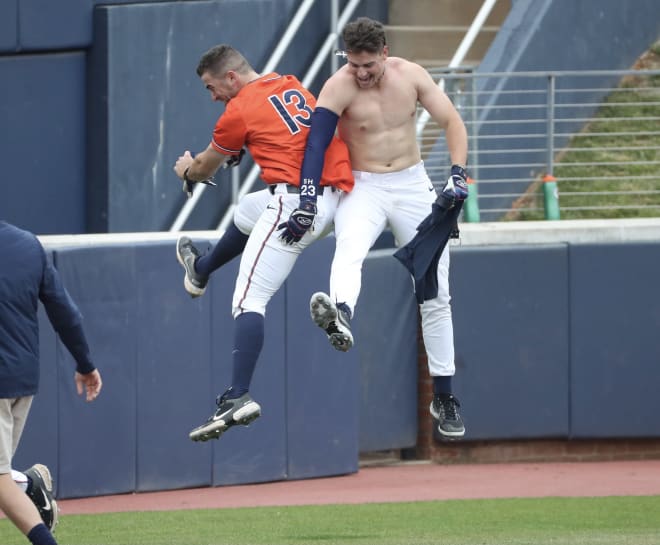 Seniors Alex Tappen (left) rushes out to celebrate Christian Hlinka walk-off double. 