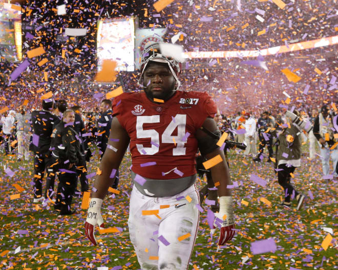 Alabama defensive lineman Dalvin Tomlinson (54) leaves the field amid a shower of confetti after the Tide lost to Clemson 35-31 in the College Football Playoff National Championship game in Raymond James Stadium in Tampa Monday, January 9, 2017. 