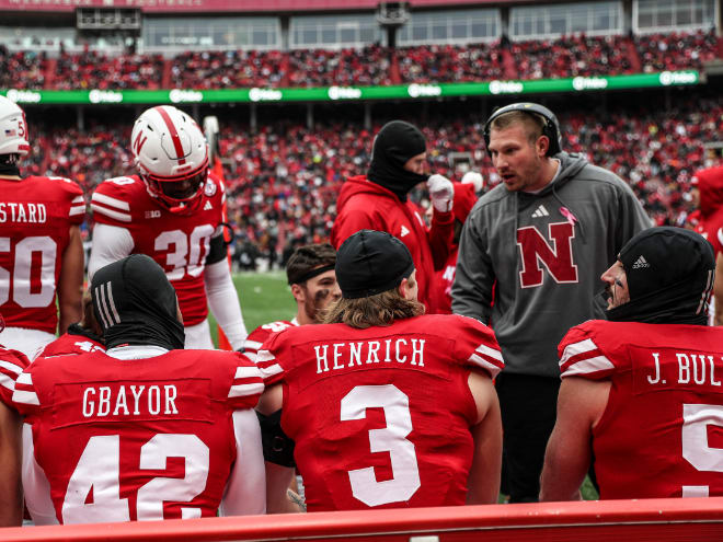 Nebraska football and linebackers coach Rob Dvoracek (right) may look to add a 'backer out of the portal