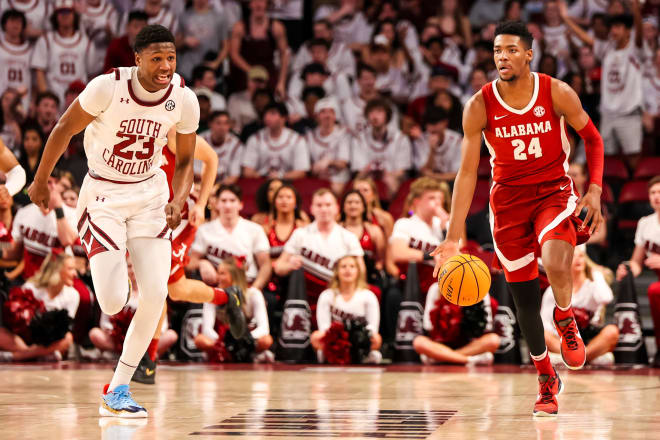 Alabama Crimson Tide forward Brandon Miller (24) brings the ball up past South Carolina Gamecocks forward Gregory Jackson II (23) in the first half at Colonial Life Arena. Photo | Jeff Blake-USA TODAY Sports