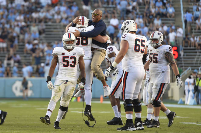 Vic So'oto, seen here during his tenure as Virginia's defensive line coach in 2017, was announced Thursday by the Buffs as their new DL coach 