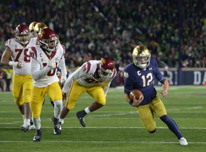 Notre Dame quarterback Ian Book scrambled for 49 yards Saturday as partof the Fighting Irish's 308 total rushing yards vs. USC.