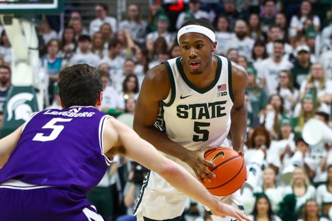 Michigan State's Tre Holloman gets ready to drive against Northwestern's Ryan Langborg in the Spartans' 53-49 victory on Wednesday night. 