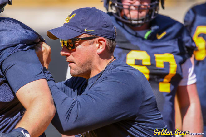 Mike Bloesch works with Cal's offensive line during training camp in August.