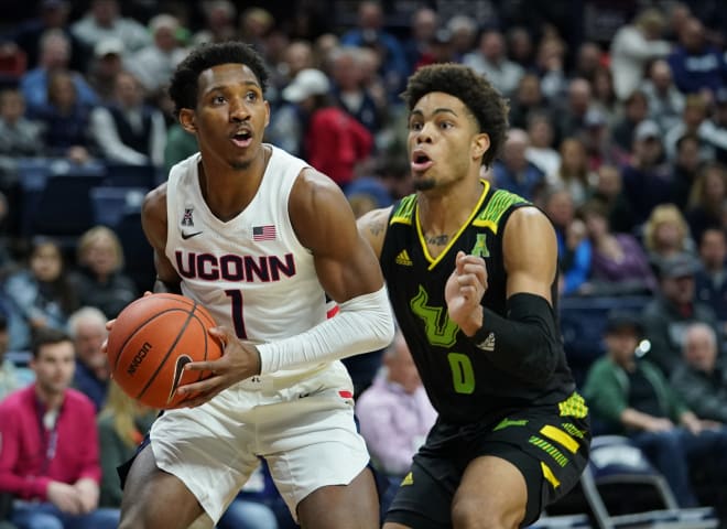 Connecticut guard Christian Vital drives the ball against USF guard David Collins in the first half at Harry A. Gampel Pavilion.