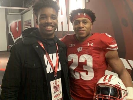 Antwan Roberts (left) with Wisconsin running back Jonathan Taylor.