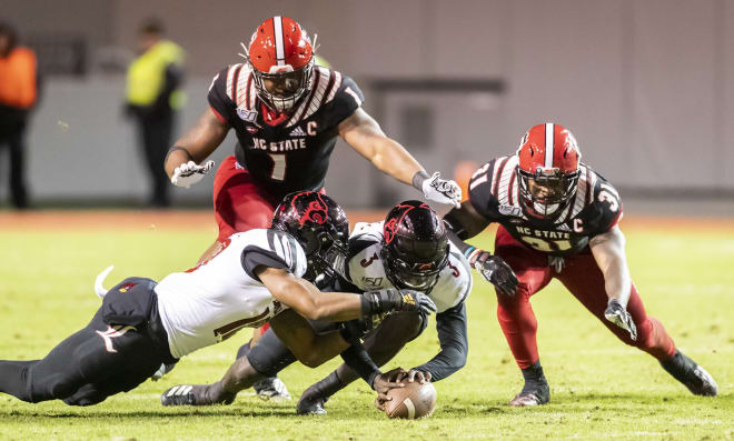 NC State fifth-year senior defensive end James Smith-Williams (No. 1) suffered a scary-looking injury versus Louisville on Saturday, but was able to walk off the field under his own power.