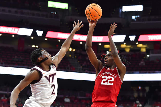 Lands (right) saw action in 32 games for Louisville, starting in six of them (AP Photo/Timothy D. Easley)