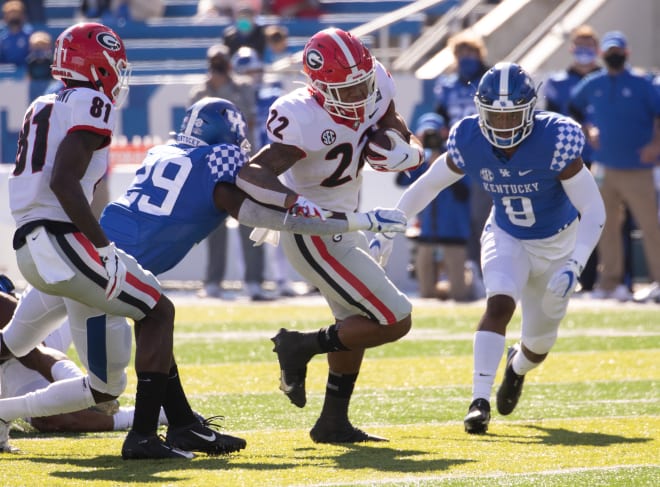 Kendall Milton fights through defenders against Kentucky. (Mark Cornelison/UGA Sports Communications)